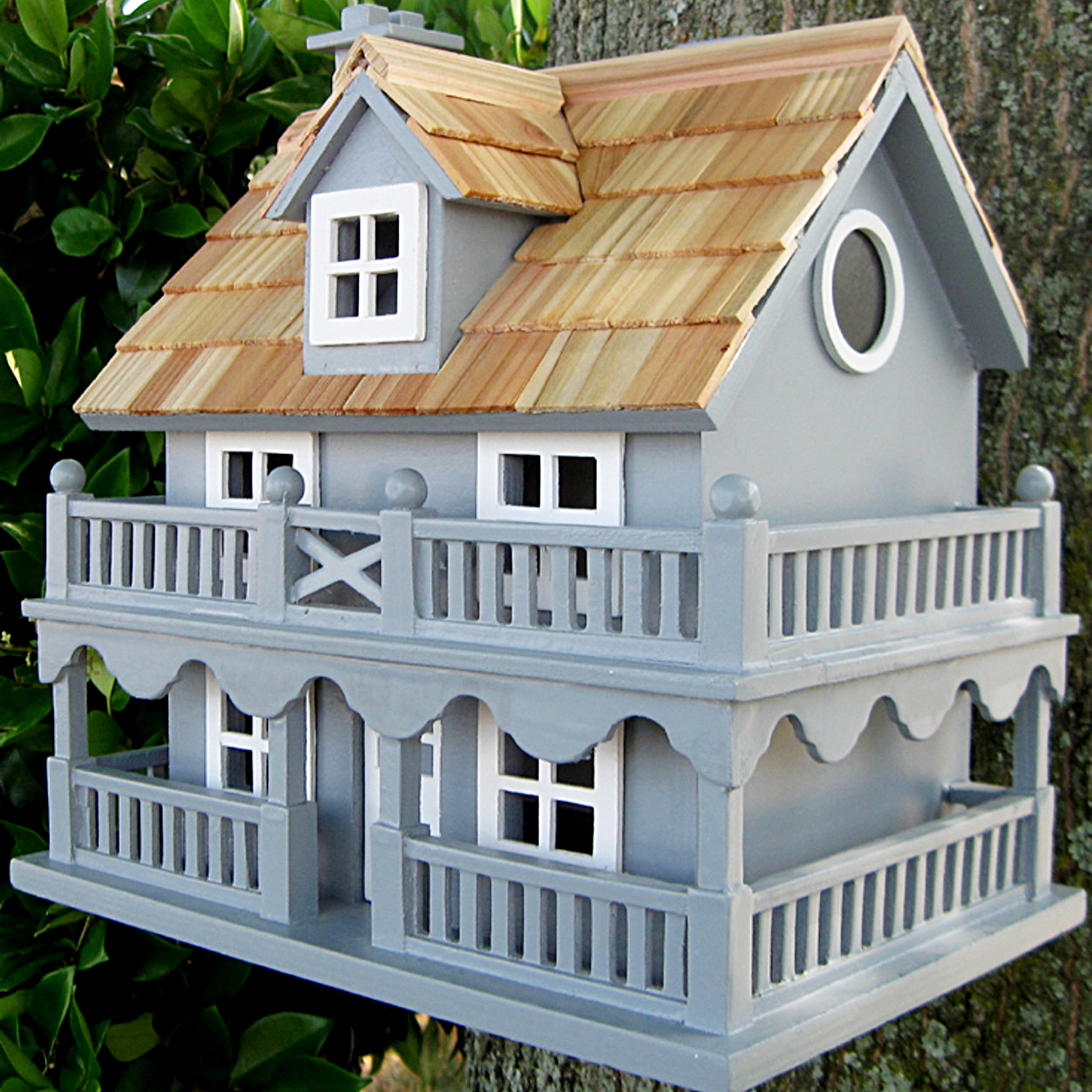 large gray New England cottage style birdhouse