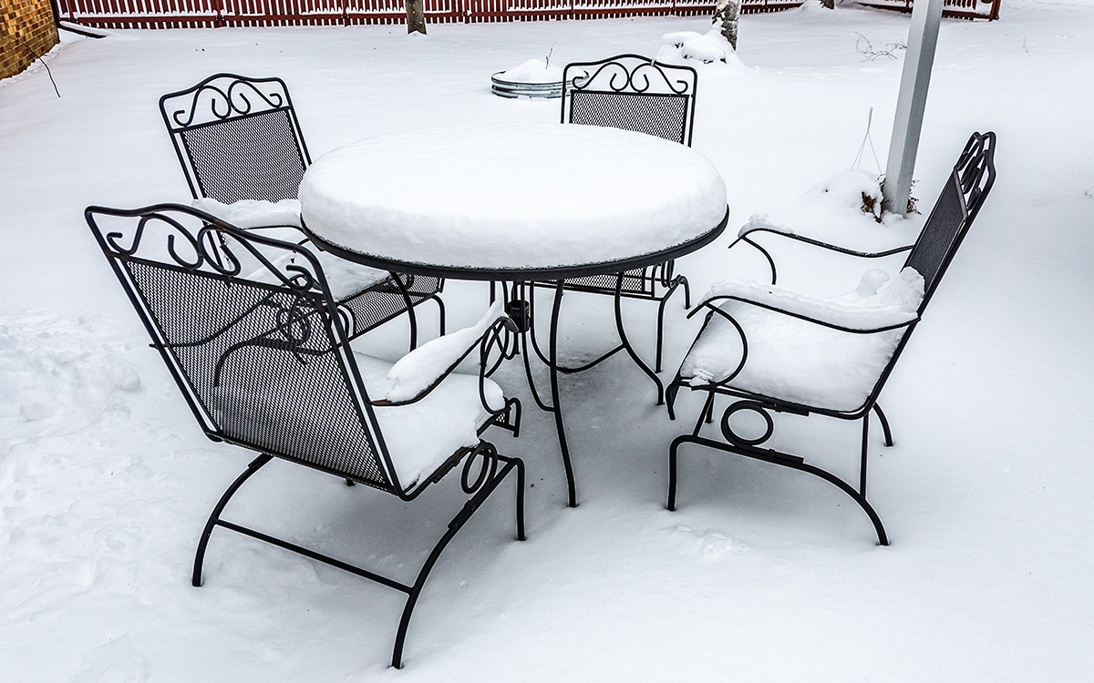 snow covered outdoor dining set